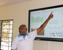 Nairobi City Water & Sewerage Company representative Mr. Mbugua presents the Power BI Technology at Ndakaini Dam.